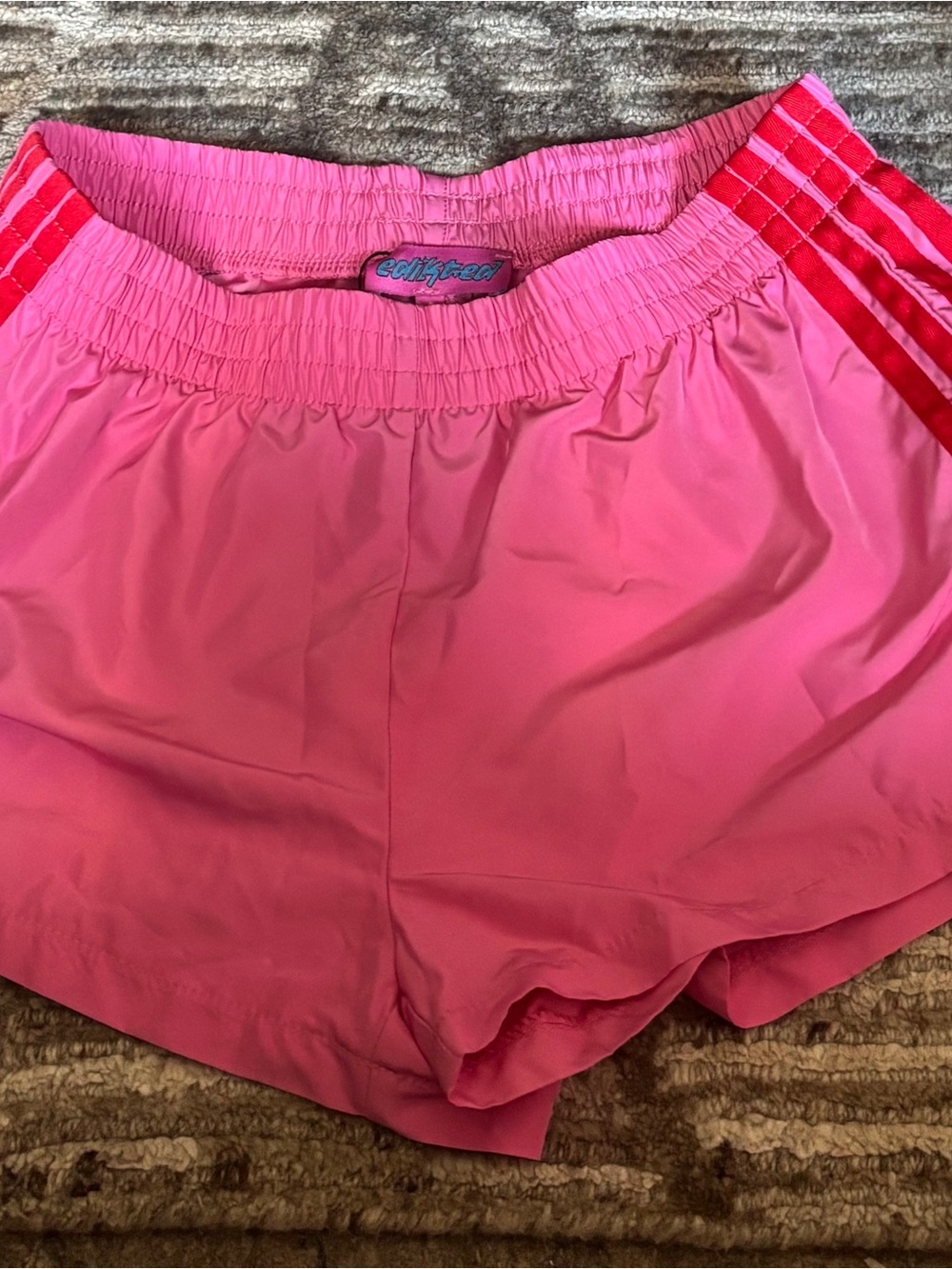 Edikted Pink Athletic Shorts with Red Stripe Detail